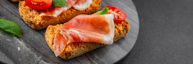 jamon bruschetta prosciutto appetizer portioned tapas dish natural tasty snack fresh delicious gourmet food background on the table rustic top view copy space