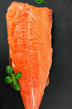 Salmon fillet raw red fish seafood dish natural tasty snack fresh delicious gourmet food background on the table rustic top view copy space pescetarian diet