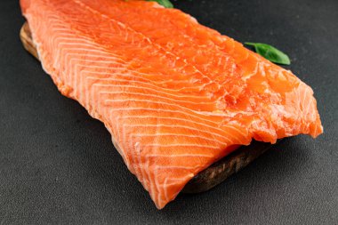 Salmon fillet raw red fish seafood dish natural tasty snack fresh delicious gourmet food background on the table rustic top view copy space pescetarian diet