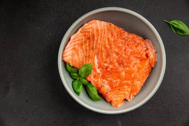 Salmon fillet raw red fish seafood dish natural tasty snack fresh delicious gourmet food background on the table rustic top view copy space pescetarian diet