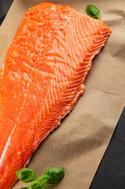 Salmon fillet raw red fish seafood dish natural tasty snack fresh delicious gourmet food background on the table rustic top view copy space pescetarian diet