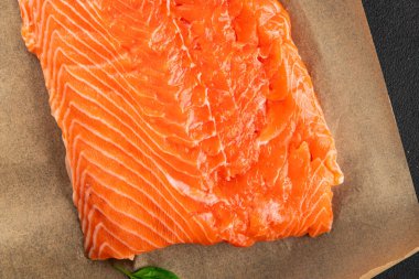Salmon fillet raw red fish seafood dish natural tasty snack fresh delicious gourmet food background on the table rustic top view copy space pescetarian diet