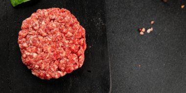 Raw cutlet meat burger ground meat beef, pork fresh natural product tasty snack delicious gourmet food background on the table rustic top view copy space
