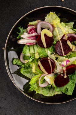 Beet salad green leaf lettuce vegetables natural product tasty snack fresh delicious gourmet food background on the table rustic top view copy space keto and paleo diet vegan and vegan food