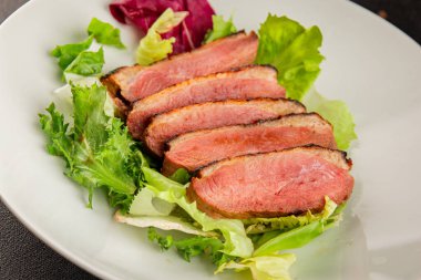 Duck breast roast poultry fresh natural product tasty snack delicious gourmet food background on the table rustic top view copy space
