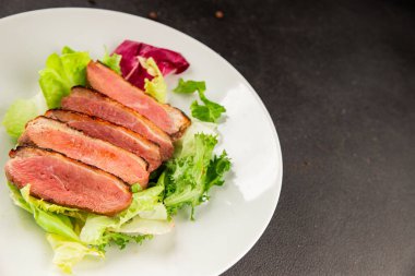 Duck breast roast poultry fresh natural product tasty snack delicious gourmet food background on the table rustic top view copy space