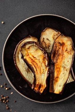 Baked eggplant grilled vegetables fresh natural product tasty snack delicious gourmet food background on the table rustic top view copy space keto and paleo diet vegan and vegan food
