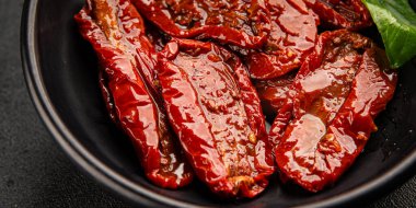 Sun-dried tomatoes snack vegetables natural product tasty snack fresh delicious gourmet food background on the table rustic top view copy space keto and paleo diet vegan and vegan food