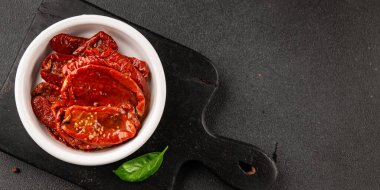 Sun-dried tomatoes snack vegetables natural product tasty snack fresh delicious gourmet food background on the table rustic top view copy space keto and paleo diet vegan and vegan food