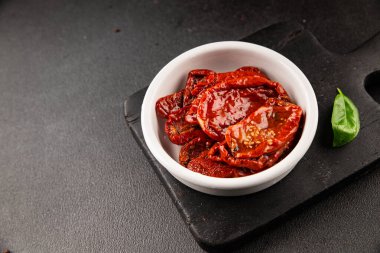 Sun-dried tomatoes snack vegetables natural product tasty snack fresh delicious gourmet food background on the table rustic top view copy space keto and paleo diet vegan and vegan food
