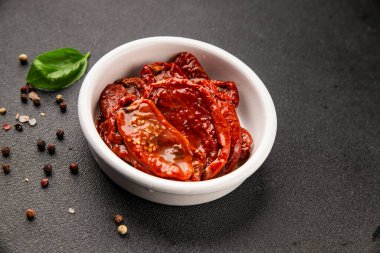 Sun-dried tomatoes snack vegetables natural product tasty snack fresh delicious gourmet food background on the table rustic top view copy space keto and paleo diet vegan and vegan food