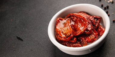 Sun-dried tomatoes snack vegetables natural product tasty snack fresh delicious gourmet food background on the table rustic top view copy space keto and paleo diet vegan and vegan food