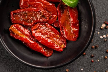 Sun-dried tomatoes snack vegetables natural product tasty snack fresh delicious gourmet food background on the table rustic top view copy space keto and paleo diet vegan and vegan food