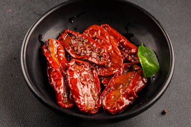 Sun-dried tomatoes snack vegetables natural product tasty snack fresh delicious gourmet food background on the table rustic top view copy space keto and paleo diet vegan and vegan food