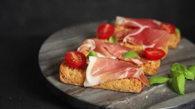 jamon bruschetta prosciutto appetizer portioned tapas dish natural tasty snack fresh delicious gourmet food background on the table rustic top view copy space