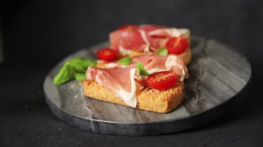 jamon bruschetta prosciutto appetizer portioned tapas dish natural tasty snack fresh delicious gourmet food background on the table rustic top view copy space