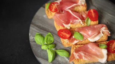 jamon bruschetta prosciutto appetizer portioned tapas dish natural tasty snack fresh delicious gourmet food background on the table rustic top view copy space