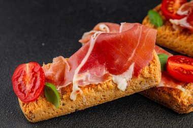jamon bruschetta prosciutto appetizer portioned tapas dish natural tasty snack fresh delicious gourmet food background on the table rustic top view copy space