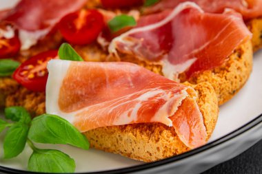 jamon bruschetta prosciutto appetizer portioned tapas dish natural tasty snack fresh delicious gourmet food background on the table rustic top view copy space