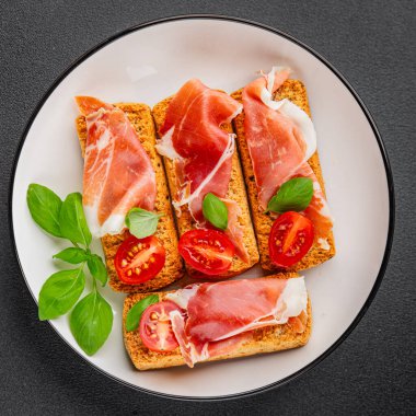 jamon bruschetta prosciutto appetizer portioned tapas dish natural tasty snack fresh delicious gourmet food background on the table rustic top view copy space