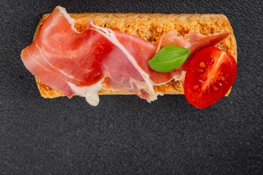 jamon bruschetta prosciutto appetizer portioned tapas dish natural tasty snack fresh delicious gourmet food background on the table rustic top view copy space