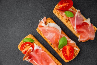 jamon bruschetta prosciutto appetizer portioned tapas dish natural tasty snack fresh delicious gourmet food background on the table rustic top view copy space
