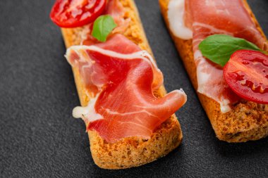 jamon bruschetta prosciutto appetizer portioned tapas dish natural tasty snack fresh delicious gourmet food background on the table rustic top view copy space