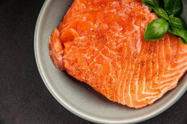 Salmon fillet raw red fish seafood dish natural tasty snack fresh delicious gourmet food background on the table rustic top view copy space pescetarian diet