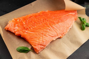 Salmon fillet raw red fish seafood dish natural tasty snack fresh delicious gourmet food background on the table rustic top view copy space pescetarian diet