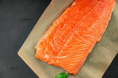 Salmon fillet raw red fish seafood dish natural tasty snack fresh delicious gourmet food background on the table rustic top view copy space pescetarian diet