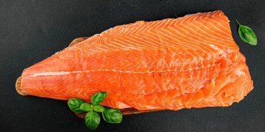 Salmon fillet raw red fish seafood dish natural tasty snack fresh delicious gourmet food background on the table rustic top view copy space pescetarian diet