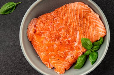 Salmon fillet raw red fish seafood dish natural tasty snack fresh delicious gourmet food background on the table rustic top view copy space pescetarian diet