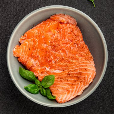 Salmon fillet raw red fish seafood dish natural tasty snack fresh delicious gourmet food background on the table rustic top view copy space pescetarian diet