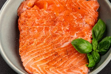 Salmon fillet raw red fish seafood dish natural tasty snack fresh delicious gourmet food background on the table rustic top view copy space pescetarian diet