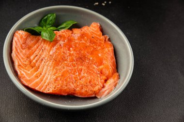 Salmon fillet raw red fish seafood dish natural tasty snack fresh delicious gourmet food background on the table rustic top view copy space pescetarian diet