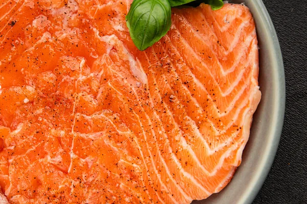 Salmon fillet raw red fish seafood dish natural tasty snack fresh delicious gourmet food background on the table rustic top view copy space pescetarian diet