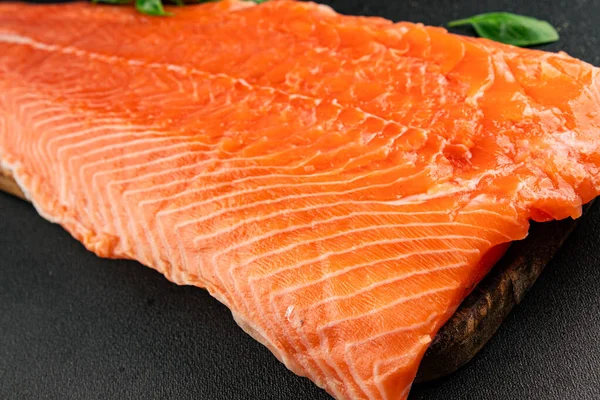 Salmon fillet raw red fish seafood dish natural tasty snack fresh delicious gourmet food background on the table rustic top view copy space pescetarian diet