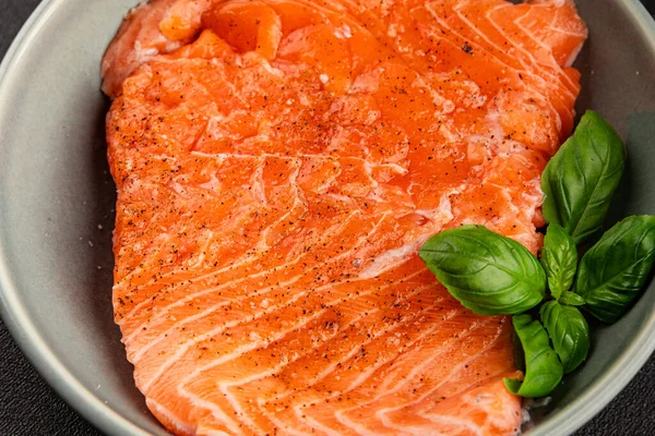 Salmon fillet raw red fish seafood dish natural tasty snack fresh delicious gourmet food background on the table rustic top view copy space pescetarian diet