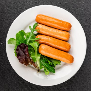 Sosis vejetaryen soya eti, bitkisel gıda, fast food, lezzetli aperatifler, lezzetli gurme yemek arka planı, masadaki rustik üst görünüm fotokopi alanı keto, ya da paleo diyet vejetaryen ya da vejetaryen yemeği.