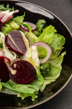 Beet salad green leaf lettuce vegetables natural product tasty snack fresh delicious gourmet food background on the table rustic top view copy space keto and paleo diet vegan and vegan food