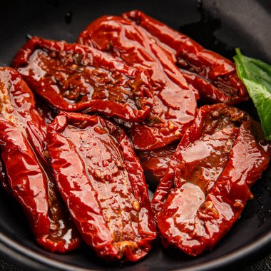 Sun-dried tomatoes snack vegetables natural product tasty snack fresh delicious gourmet food background on the table rustic top view copy space keto and paleo diet vegan and vegan food