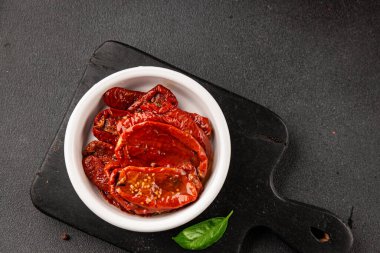 Sun-dried tomatoes snack vegetables natural product tasty snack fresh delicious gourmet food background on the table rustic top view copy space keto and paleo diet vegan and vegan food