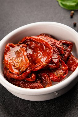 Sun-dried tomatoes snack vegetables natural product tasty snack fresh delicious gourmet food background on the table rustic top view copy space keto and paleo diet vegan and vegan food
