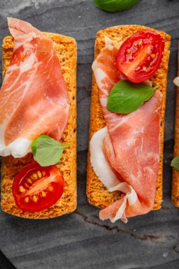 jamon bruschetta prosciutto appetizer portioned tapas dish natural tasty snack fresh delicious gourmet food background on the table rustic top view copy space