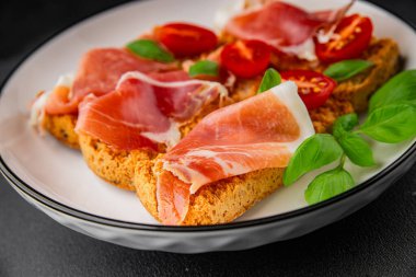 jamon bruschetta prosciutto appetizer portioned tapas dish natural tasty snack fresh delicious gourmet food background on the table rustic top view copy space