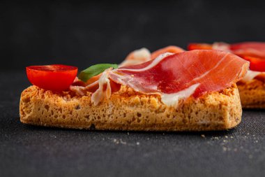 jamon bruschetta prosciutto appetizer portioned tapas dish natural tasty snack fresh delicious gourmet food background on the table rustic top view copy space