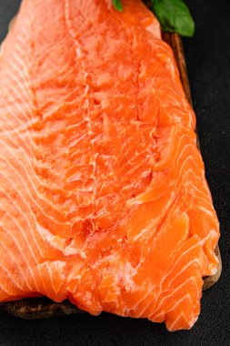 Salmon fillet raw red fish seafood dish natural tasty snack fresh delicious gourmet food background on the table rustic top view copy space pescetarian diet