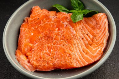 Salmon fillet raw red fish seafood dish natural tasty snack fresh delicious gourmet food background on the table rustic top view copy space pescetarian diet