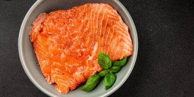 Salmon fillet raw red fish seafood dish natural tasty snack fresh delicious gourmet food background on the table rustic top view copy space pescetarian diet