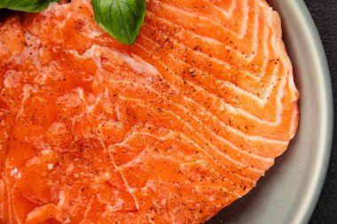 Salmon fillet raw red fish seafood dish natural tasty snack fresh delicious gourmet food background on the table rustic top view copy space pescetarian diet